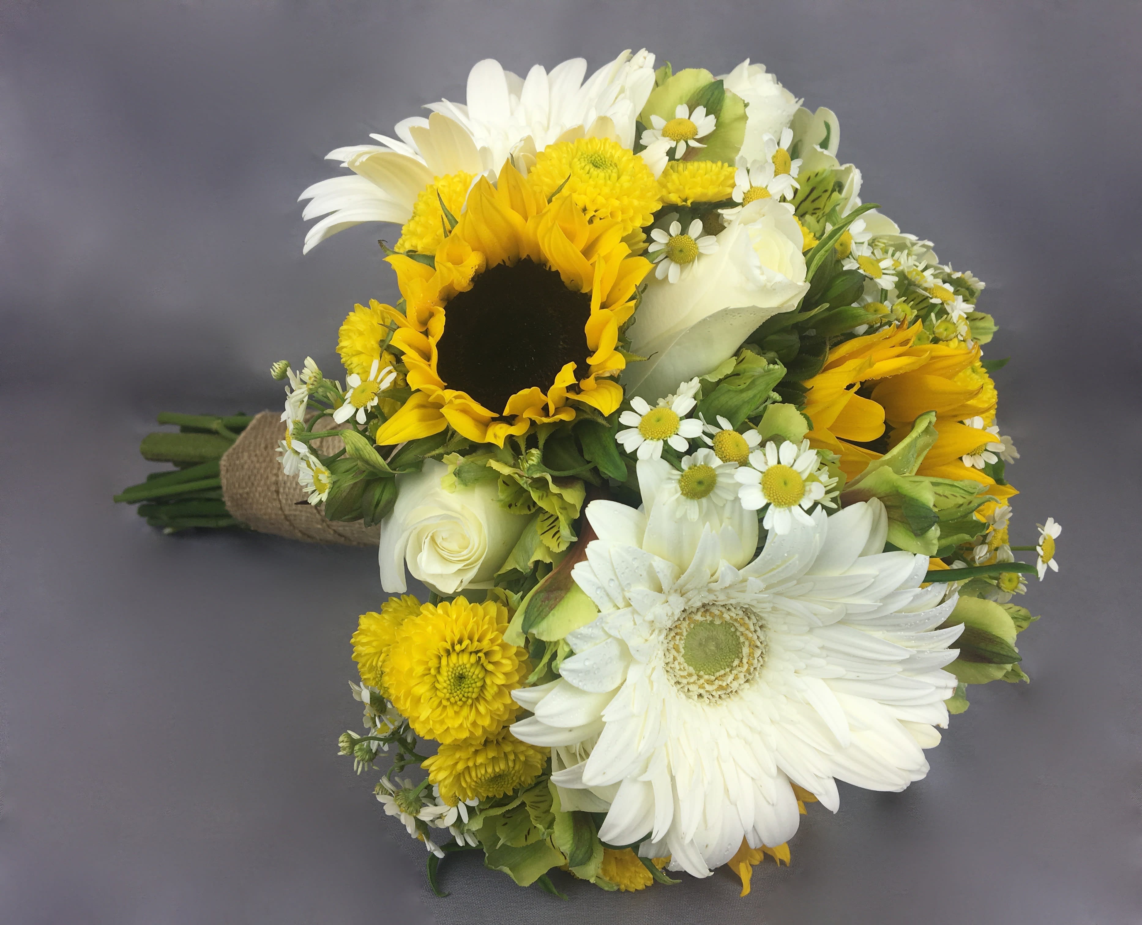 Bouquet of sunflowers, white daisies, and white roses