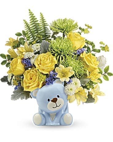 Yellow flower bouquet in a blue teddy bear vase