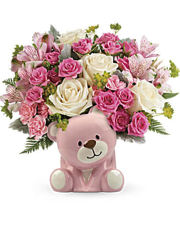 Pink and white rose bouquet in a pink teddy bear container