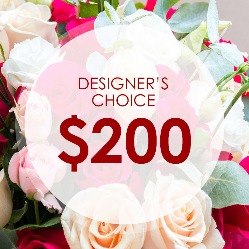 Mixed bouquet of white, pink, and peach roses with a $200 designer's choice label