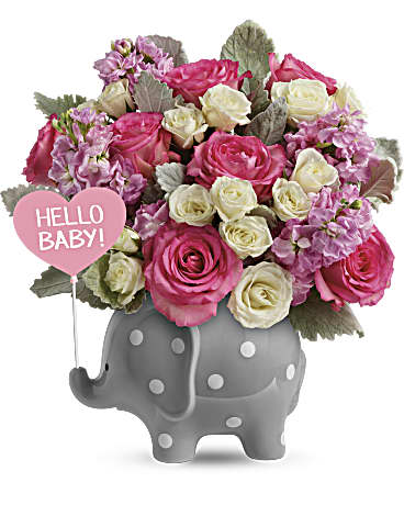 Pink and white rose bouquet in a gray elephant vase with a Hello Baby sign