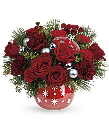 Red roses and carnations in a red ornament vase with silver baubles