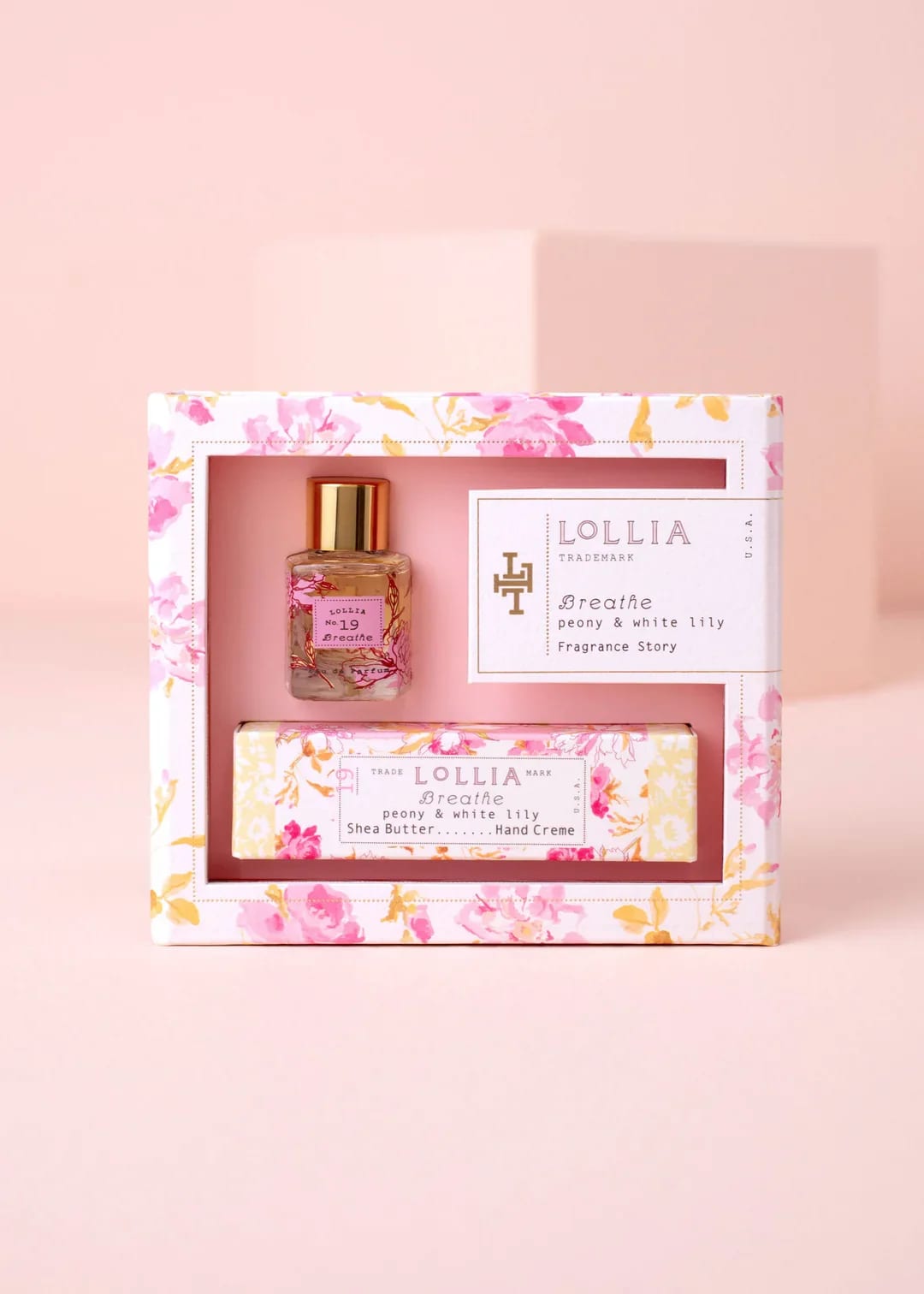Breathe - Lollia Fragrance Gift Set - From Margot Elena: Delve into a captivating fragrance story. This chic petite pairing of Eau de Parfum and Shea Butter Handcreme is the perfect introduction to the tantalizing Breathe fragrance, for yourself or as a gift. A decadent duo, enjoy silky smooth, delightfully scented skin. A sublime set for on-the-go luxury.  A floral heart of ruffled Peony and White Lily with sheer hints of fresh Grapefruit and Orange. A fresh air impression infused with leafy green notes surrounded by a hint of cool, mossy forest paths.  Design Details: Elevated gifting. Nestled inside an elegant keepsake gift box glowing with golden accents and sophisticated detailing. So beautiful you can even forego the wrapping.  Includes, in a Gift Box: 1 Breathe Little Luxe Eau de Parfum 1 Breathe Petite Treat Handcreme