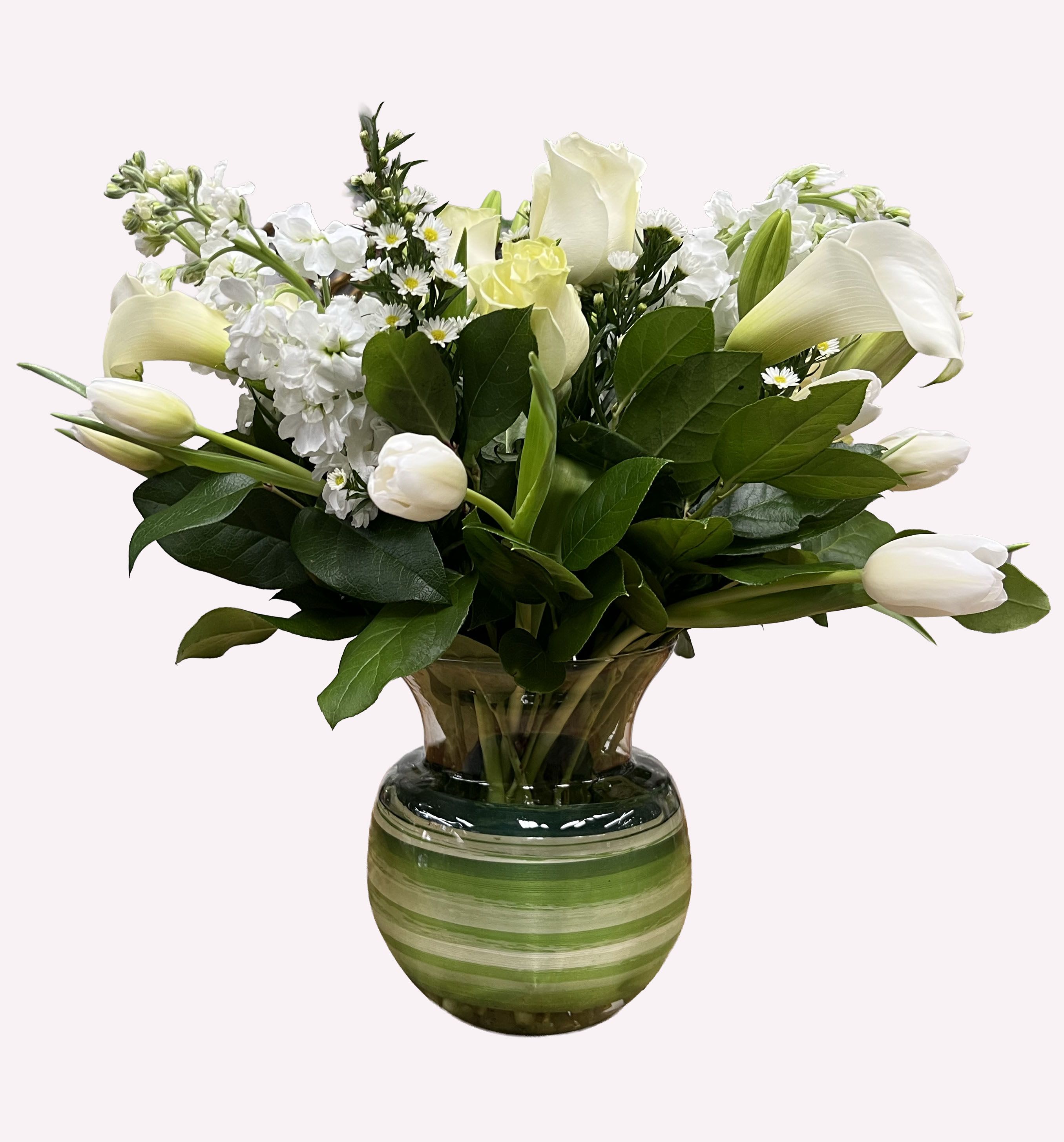 White flowers arranged in a green striped glass vase