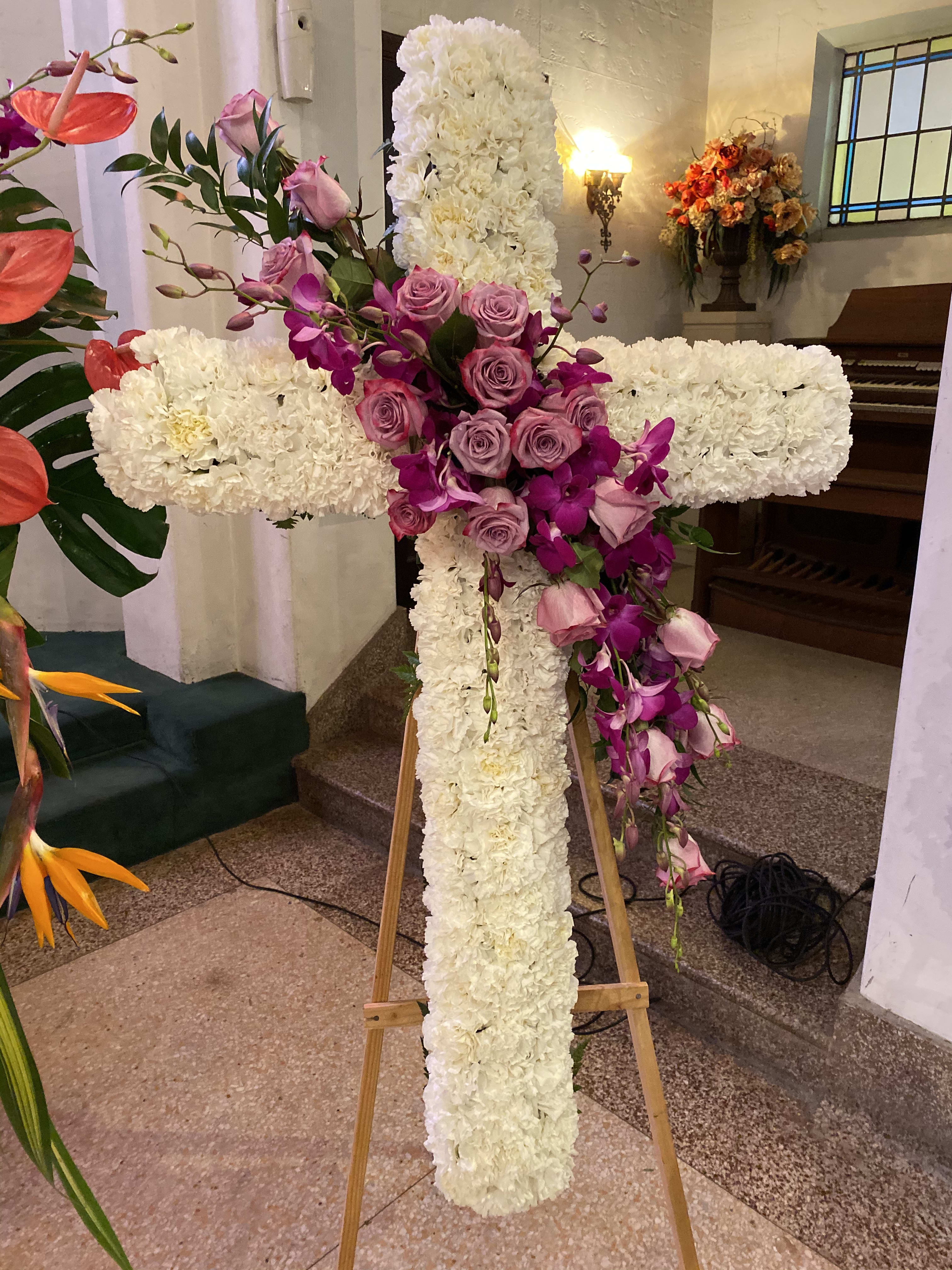 Cross - Elegant 30" white cross on aisle. White carnations, lavender roses and Bombay orchid