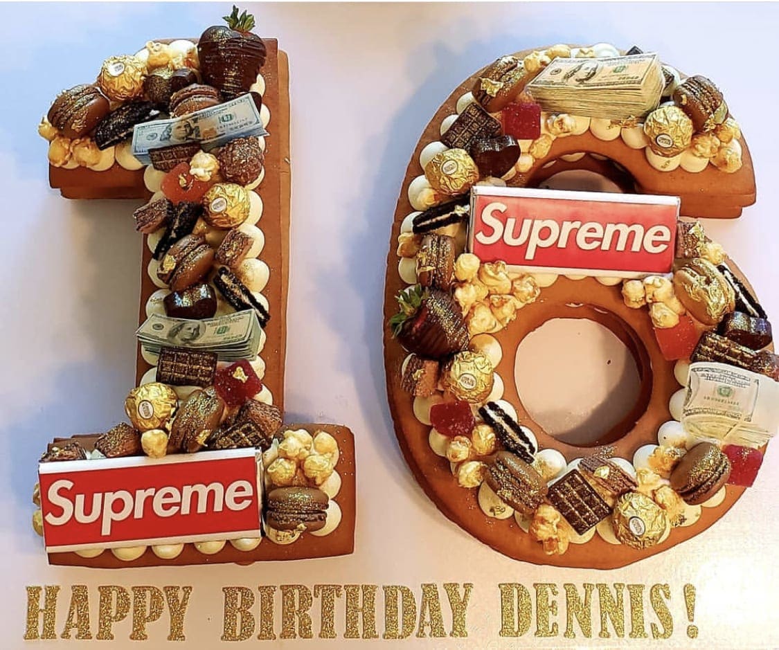 Number 18 birthday display decorated with candy and cash