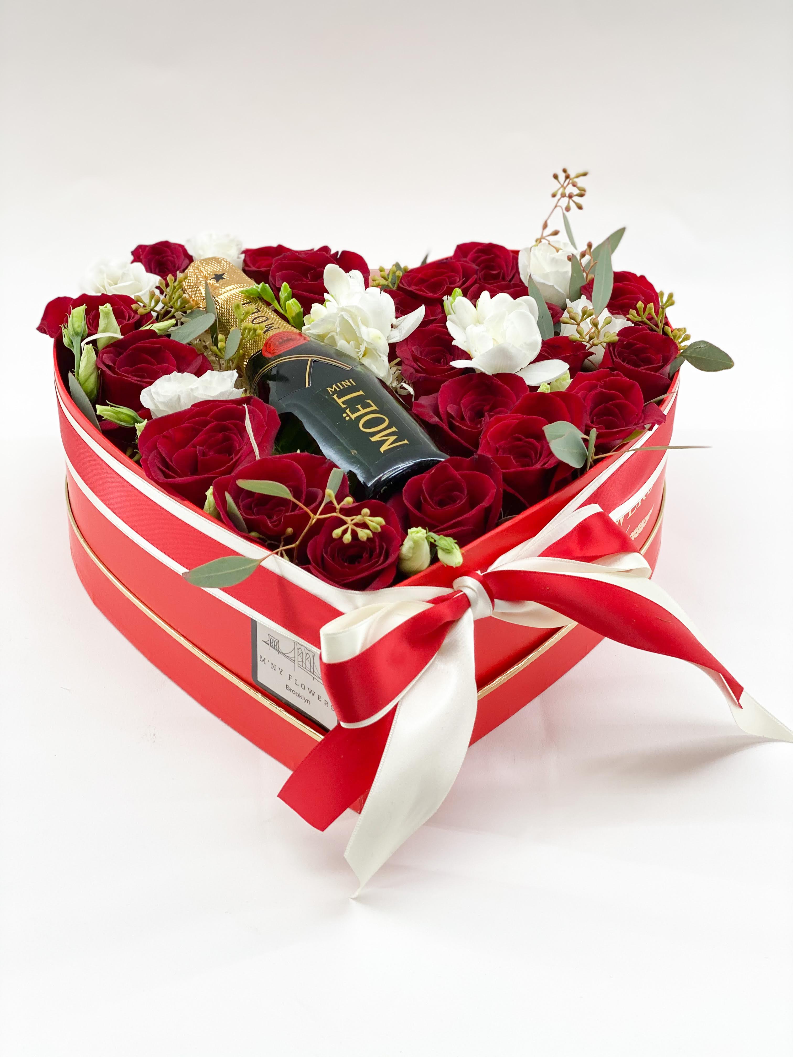Heart-shaped box of red and white roses with a mini Moet bottle