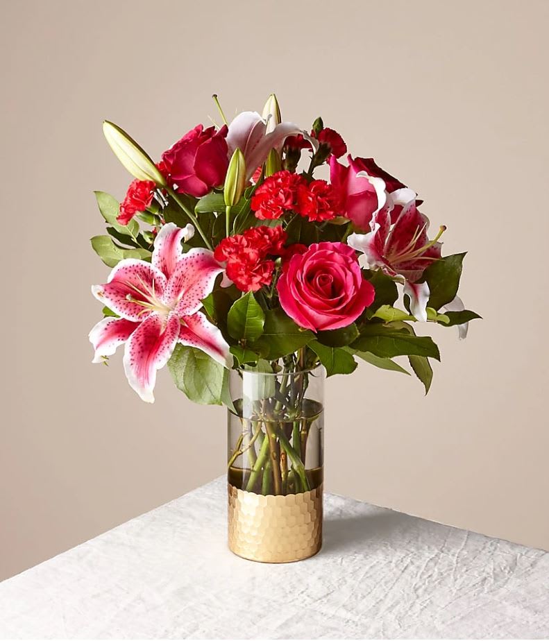 Be Mine Bouquet - The Better Bouquet is about 21"H by 17"W. For long–lasting blooms replace water and trim stems daily. The bouquet pictured reflects our original design for this product. While we always try to follow the color palette, we may replace stems to deliver the freshest bouquet possible, and we may sometimes need to use a different vase.