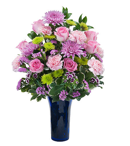 Great Admiration TMF-593 - A lush and lovely combination of long lasting varieties of pastel color flowers in a cobalt blue vase.  Approximately 8" W X 16" H  As Shown : TMF-593