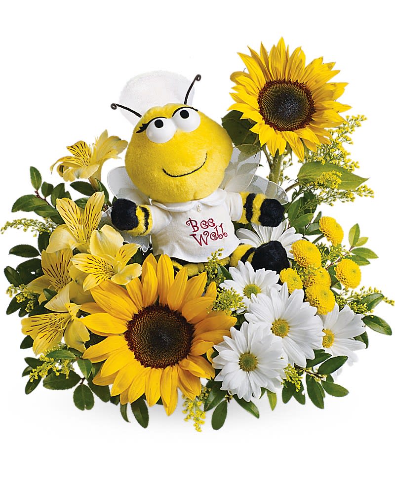 Bee plush surrounded by sunflowers and daisies