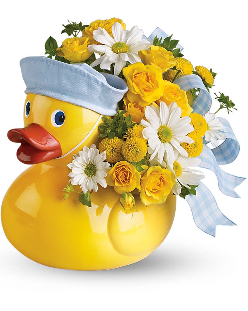 Yellow duck-shaped vase with yellow and white flowers and blue ribbon