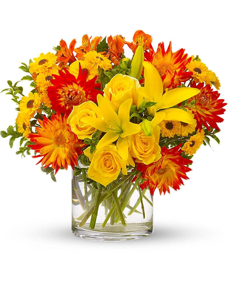 Yellow and red mixed bouquet in a clear glass vase