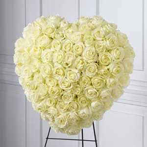 The FTD® Elegant Remembrance Standing Heart - The FTD&reg; Elegant Remembrance&trade; Standing Heart is an exquisite display of peace and love. 77 stems of white roses are artfully arranged in the shape of a heart and presented on a wire easel, creating a simply beautiful tribute for their final farewell service.