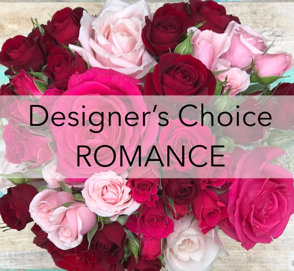 Assorted pink and red roses with the words "Designer’s Choice ROMANCE" overlaid.