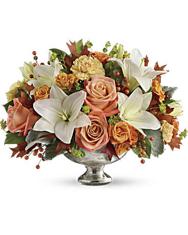 Harvest Shimmer Centerpiece - Autumn shimmer! Dress their fall table with this gorgeous, seasonal work of art! Hand-delivered in a stunning mercury glass bowl, this harmonic mix of white lilies and peach roses is sure to make their season memorable.
