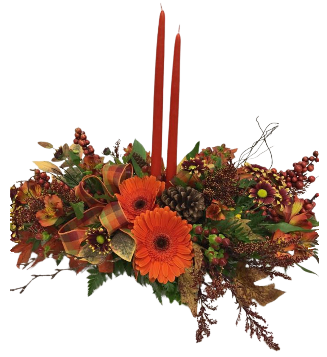 Family Traditions - A traditional fall centerpiece perfect for a family dinner or table piece for a get together. This low centerpiece has fall pomps, alstromeria, berries, and gerbera daisies. It is finished will fall accents, ribbons, and candles.