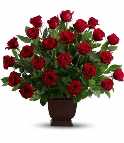 Red roses arranged in a brown urn-style vase