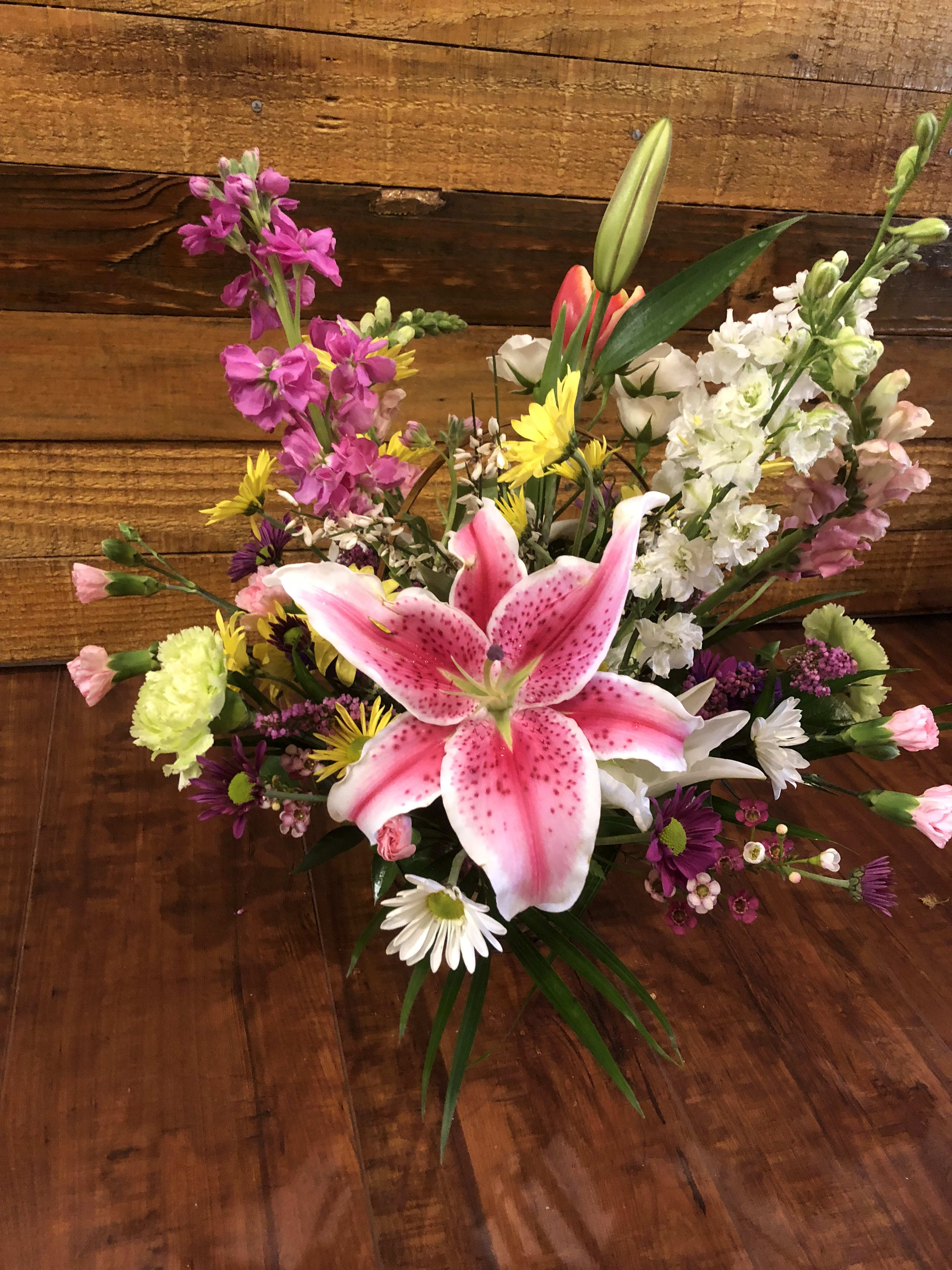 Mixed bouquet with a pink stargazer lily and colorful blooms