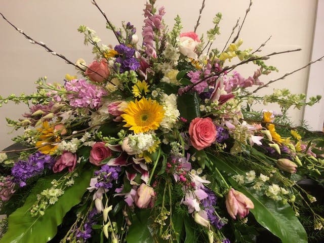 Large mixed floral spray with pink, purple, yellow, and white blooms