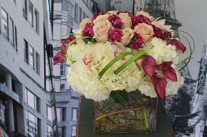 Just the way you are - In this arrangement Hydrangea, Calla Lillies, Orchids, Roses and sweet Williams are arranged in a large cube.