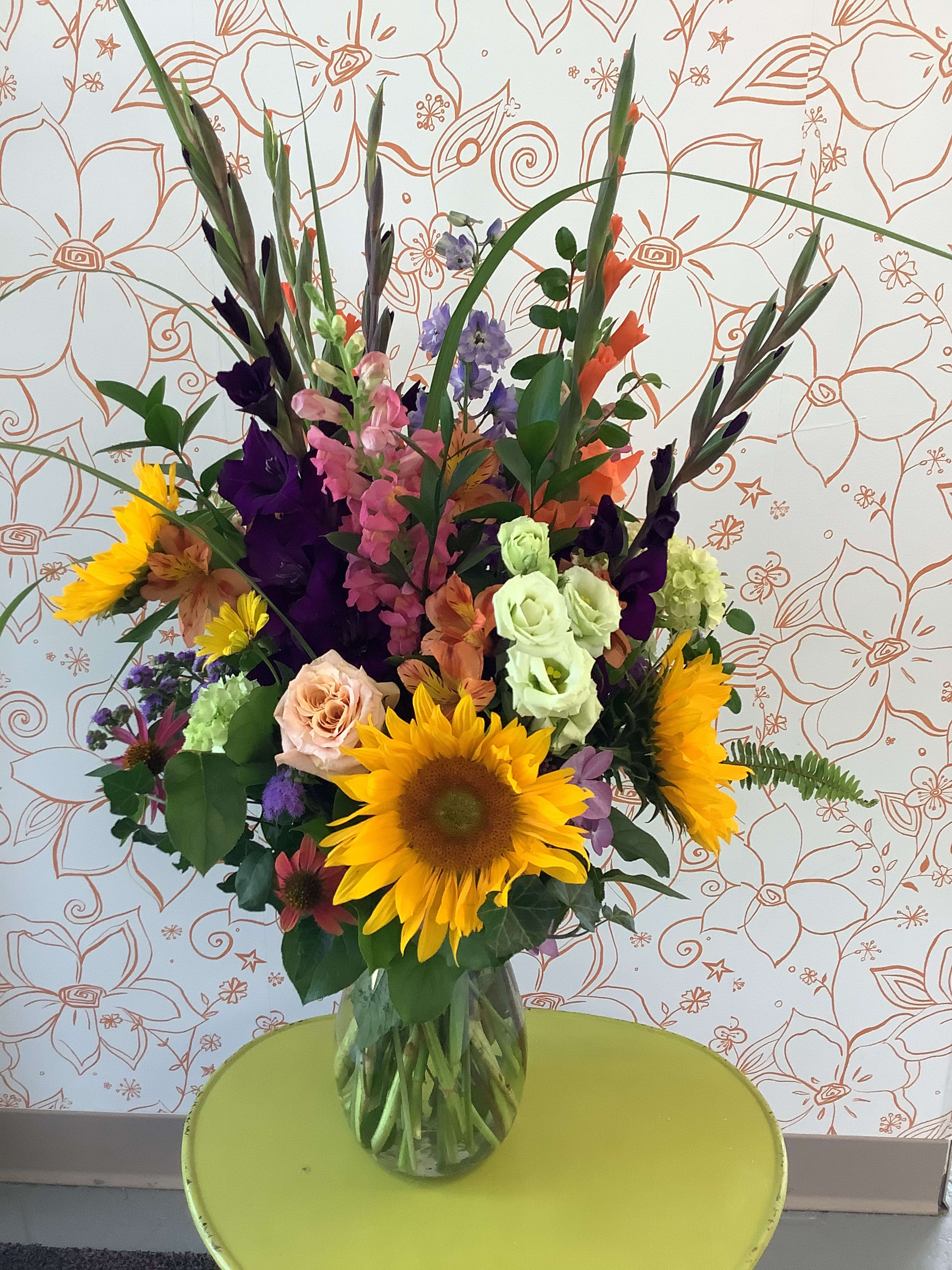 Colorful garden mix - This gorgeous presentation features the brightest and blooms of the current season. An impressive size of 32” tall and about 18” wide. Please read our substitution policy.