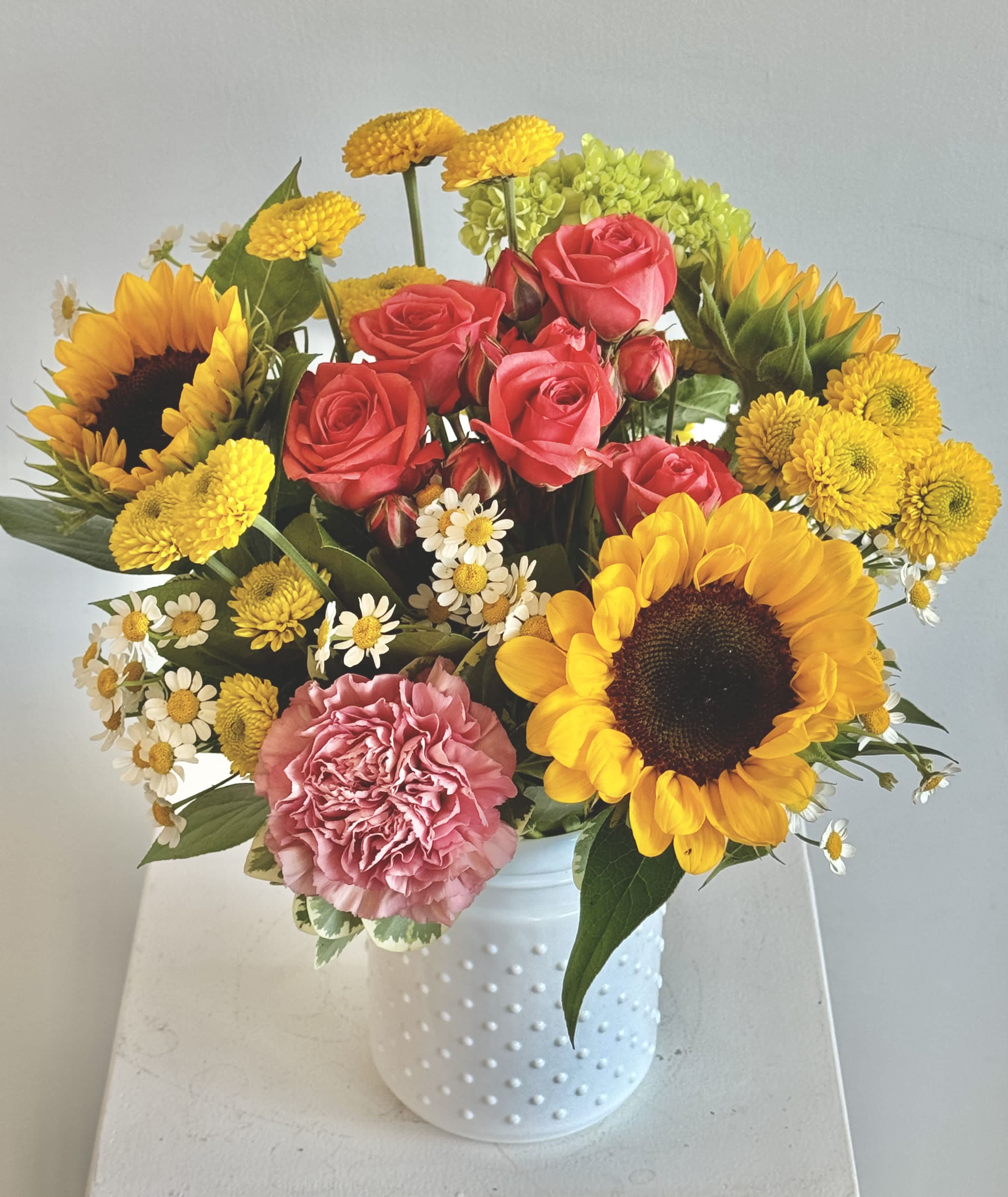 Sun Glow - This fun bright mixed vase is a great way to celebrate any occasion, from birthdays to graduations to corporate milestones and more! Need it right away? Same day delivery available throughout the Grand Rapids area! PLEASE READ SUBSTITUTION POLICY