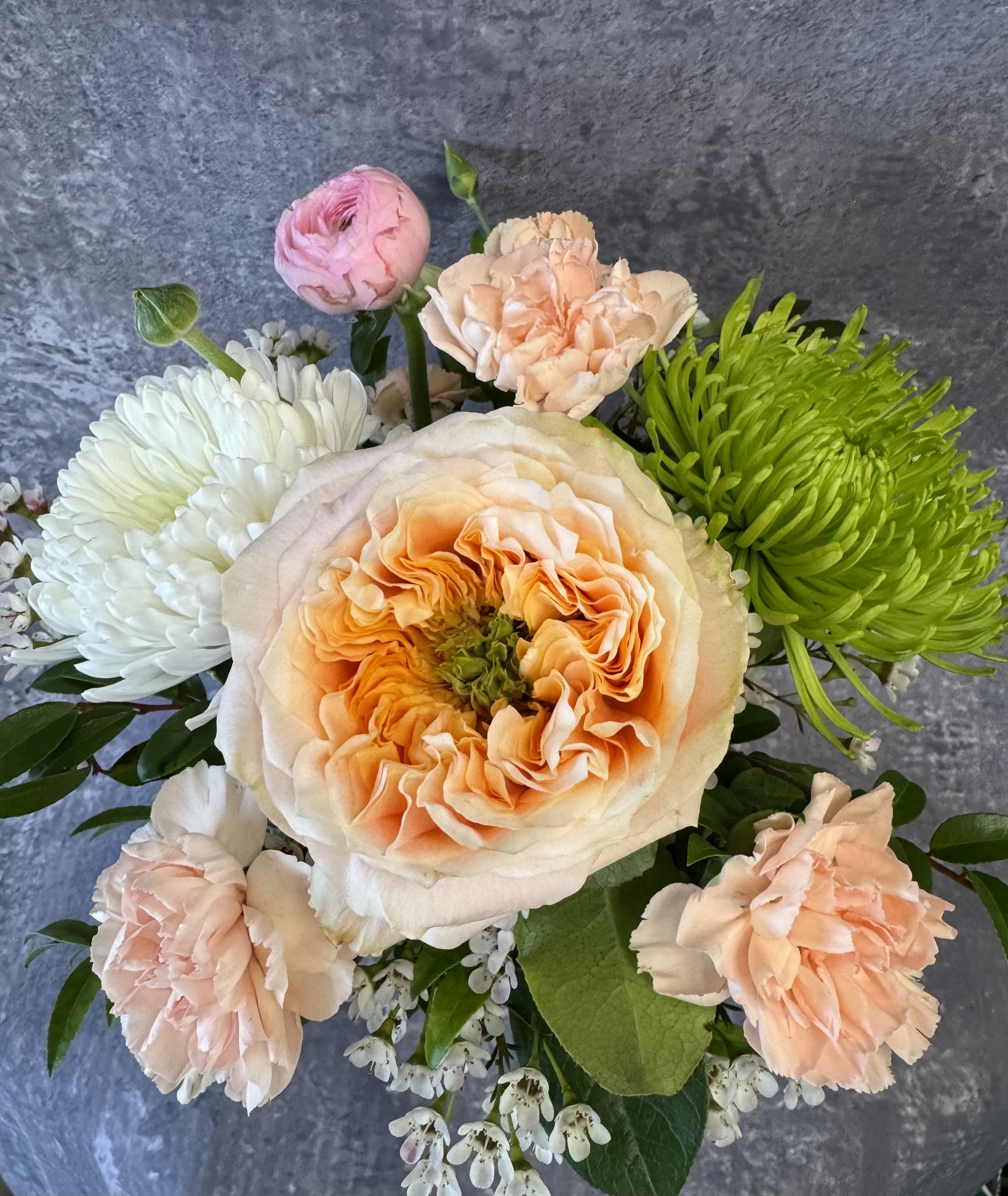 Bouquet of peach, pink, white, and green flowers