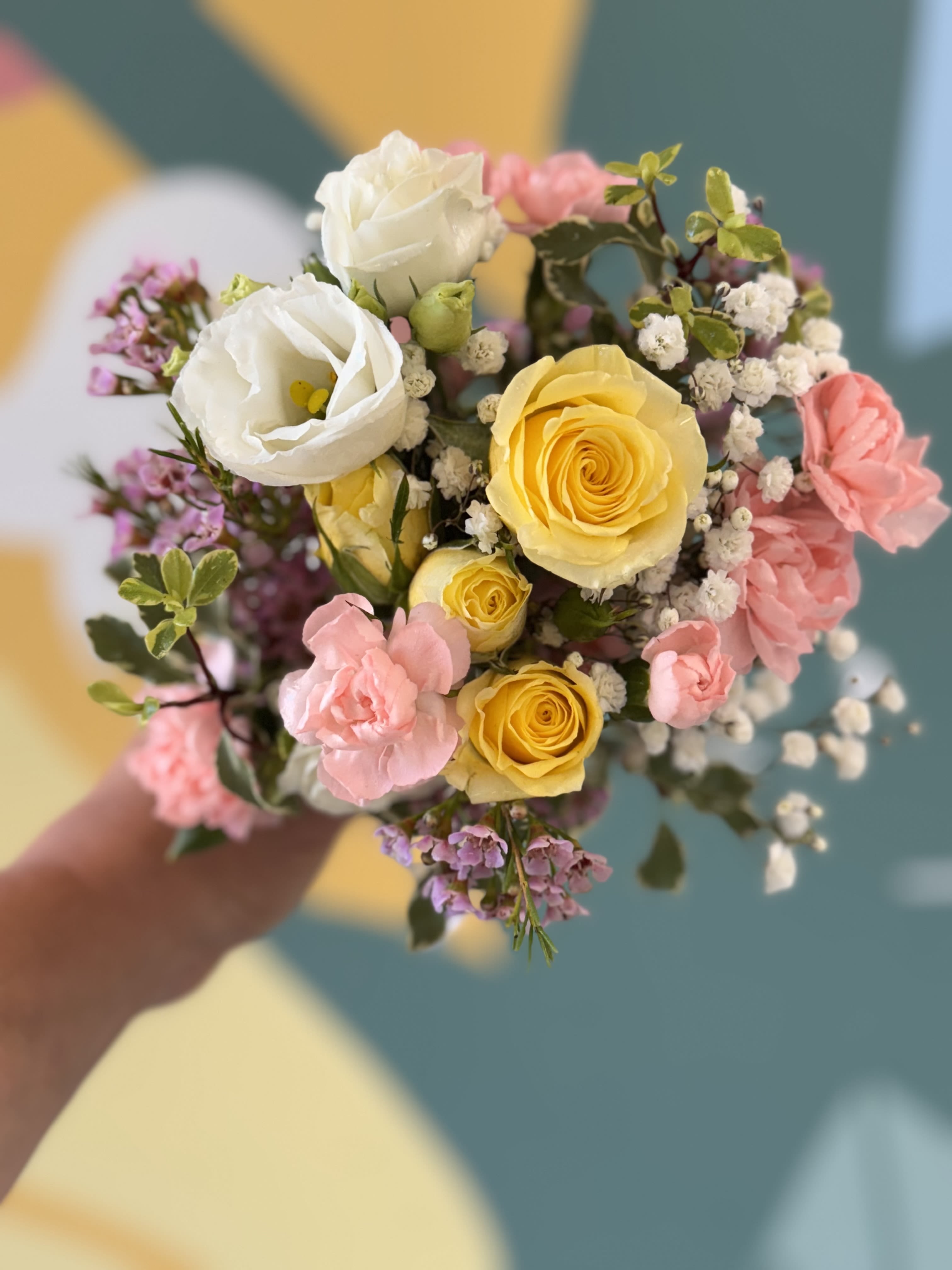 Soft and elegant handheld bouquet - Soft colors of creams, light pinks, lavenders and pale yellows create an elegant hand help bouquet.