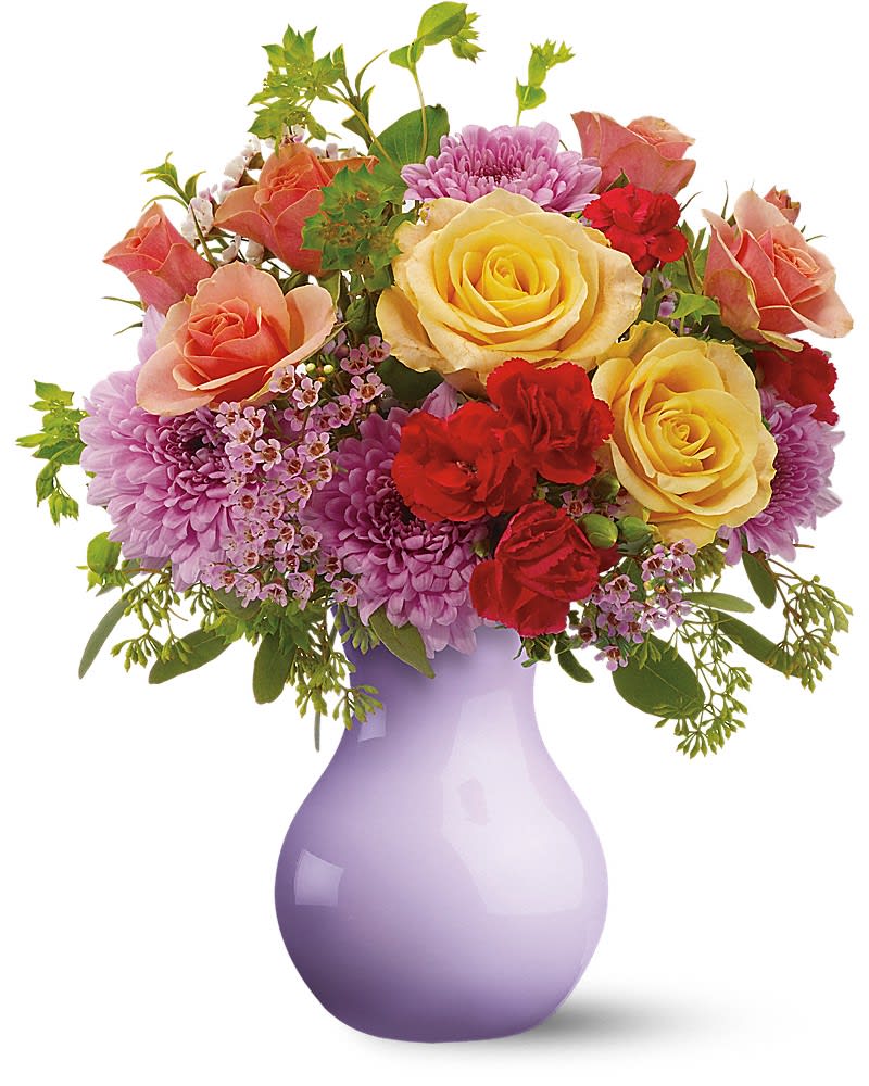 Mixed bouquet of yellow roses, red carnations and purple mums in a lavender vase