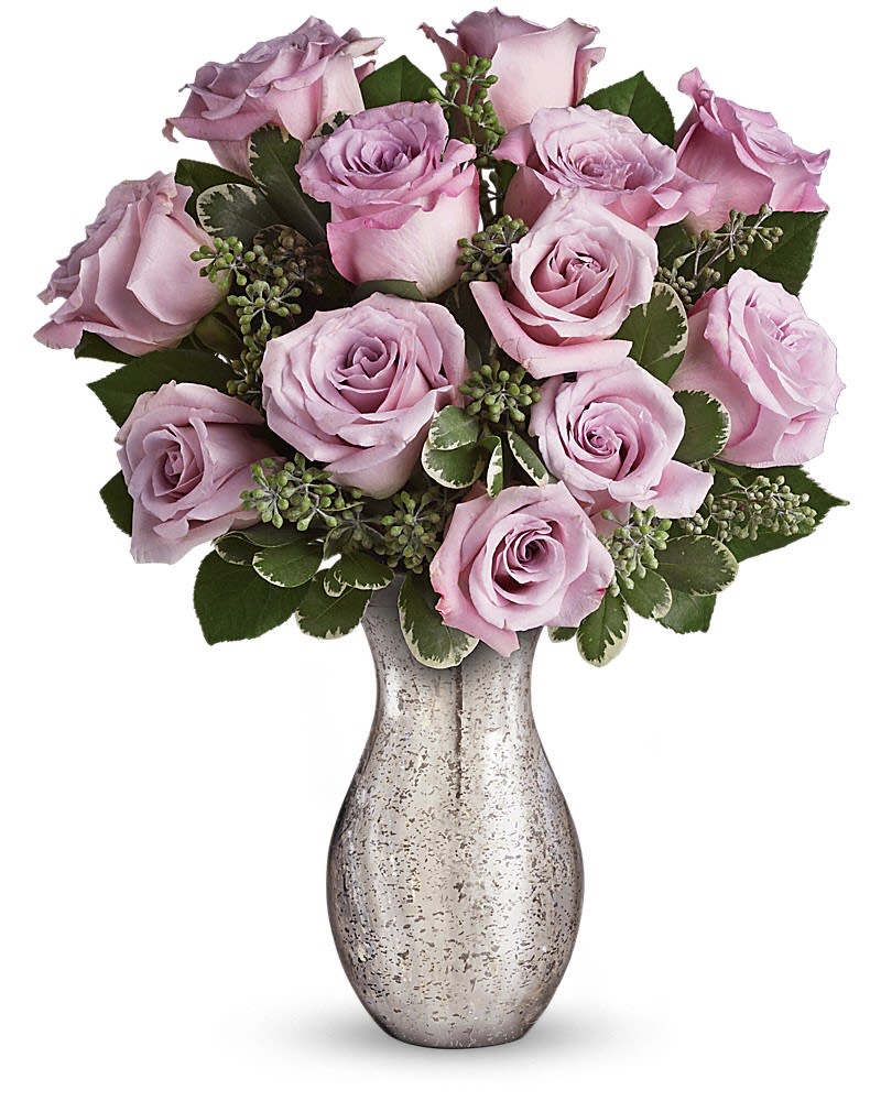 Arrangement of lavender roses in a speckled silver vase.