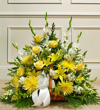 Yellow and white basket arrangement with roses, lilies, and mums