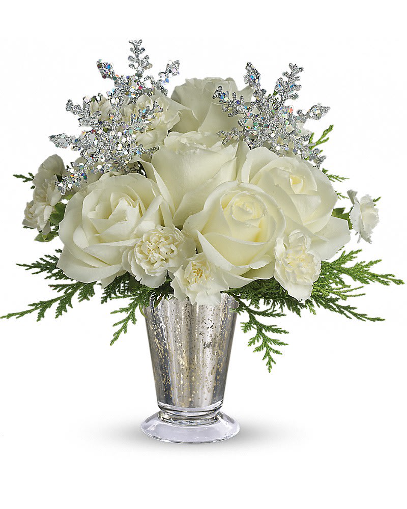Teleflora's Winter Glow - Sparkling and splendid, this elegant arrangement is perfect for any winter celebration. It makes a spectacular centerpiece, amazing room accent, even an inspired anniversary gift. Especially if it's a silver anniversary! Gorgeous white roses, asiatic lilies and miniature carnations are beautifully arranged with magical silver snowflakes and delivered in a glamorous silver Mercury Glass Vase. Glow ahead and send this stunner today!