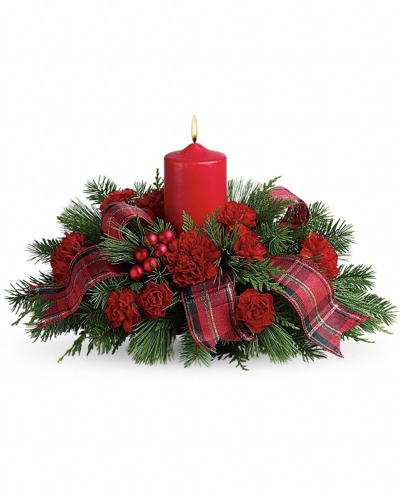 Family Celebration - This beautiful arrangement is the perfect way to celebrate the holidays with friends and family. If you're invited to a gathering, send it a couple of days in advance. If you can't actually be there in person, your presence will be felt when you send this lovely present. Festive red carnations, shiny ornament balls, winter greens, an elegant pillar candle and red taffeta ribbon make this a charming celebration of the season.
