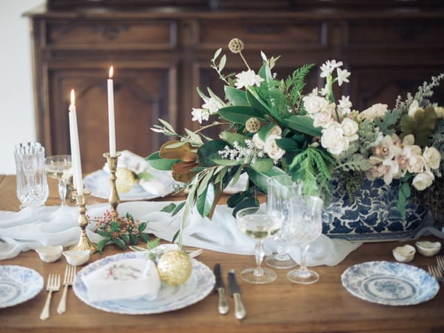 Frosty Love Winter Centerpiece - When it’s time to gather up close to feel the warmth of each other’s comfort, compliment the winter mood by bringing a touch of the outdoors in.  Perfect on your own dining table or a great centerpiece hostess gift, this neutral white floral and warm Rich foliage centerpiece brings the perfect holiday detail to any decor. 