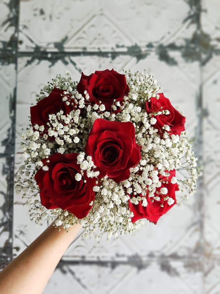 Bouquet of red roses with white baby's breath