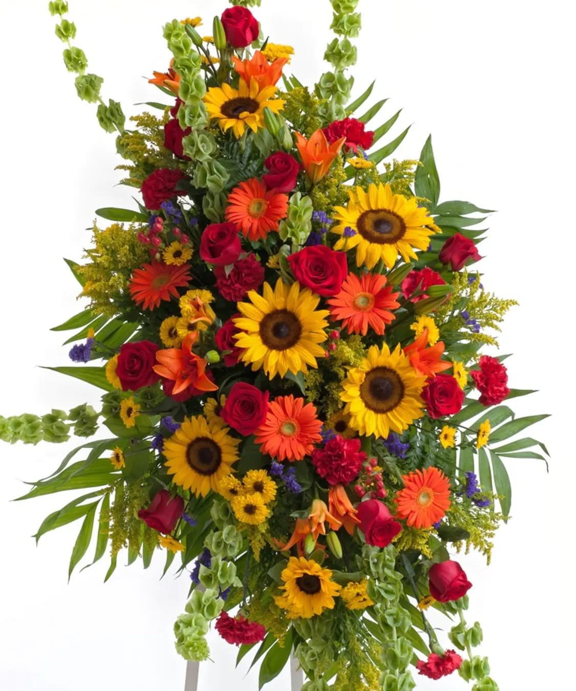 Tall standing spray of sunflowers, roses, and orange blooms