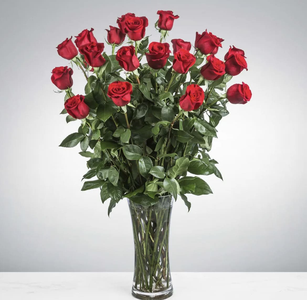 Two Dozen Long Stemmed Roses by BloomNation™ - These two dozen red roses provides the classic romantic gift. It's perfect for Valentine's Day or an Anniversary. APPROXIMATE DIMENSIONS: 30" H X 22" W