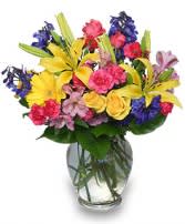 Colorful mixed bouquet in a clear glass vase