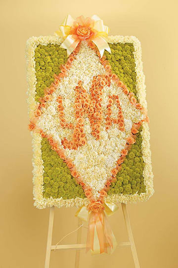 Customized Monogram Standing Spray - Premium Size shown in eample image.   Available beginning at $650  Hignight's Customized Monogram Standing Spray is our most unique way to memorialize a beloved family member. To customize this product in colors, monograms, and size, please call our flower shop in East Moline, Illinois to speak to a designer about delivering the perfect tribute to your loved one's memorial service, funeral, visitation, or celebration of life. Available in almost all colors.   Depending on seasonal availabilty, substitutions may be made. Colors, style, and value will remain close to the general style and theme of the original arrangement   For Delivery to the following Funeral Homes, Mortuaries, and Crematories in East Moline and other Quad Cities: Van Hoe Funeral Home, Esterdahl Mortuary &amp; Crematory, Sullivan Ellis Mortuary, Schroder Mortuary, Wheelan Pressly Funeral Home, Rafferty Funeral Home, Trimble Funeral Home, DeRoo Funeral Home, Orr Mortuary, Knox Chapel, Wendt Funeral Home, McGinnis Chambers Funeral Home, Cunnick Collins Funeral Home, Runge Mortuary, Weert Funeral Home.
