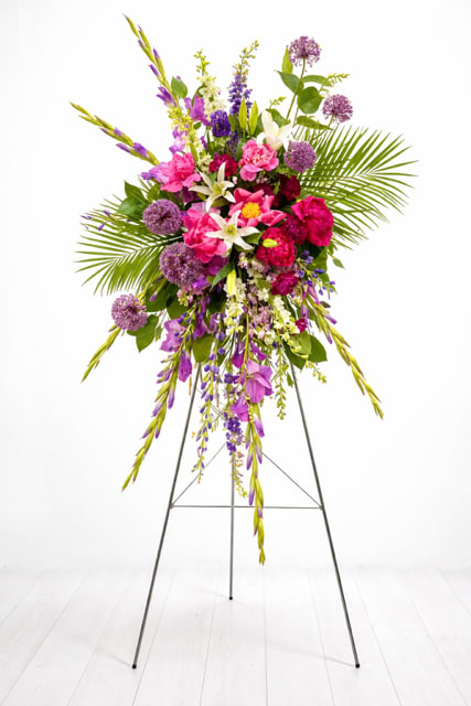 Tall standing floral spray with pink, purple, and white flowers