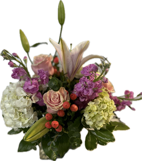 Pink lilies, roses, hydrangeas, and purple blooms in a bouquet
