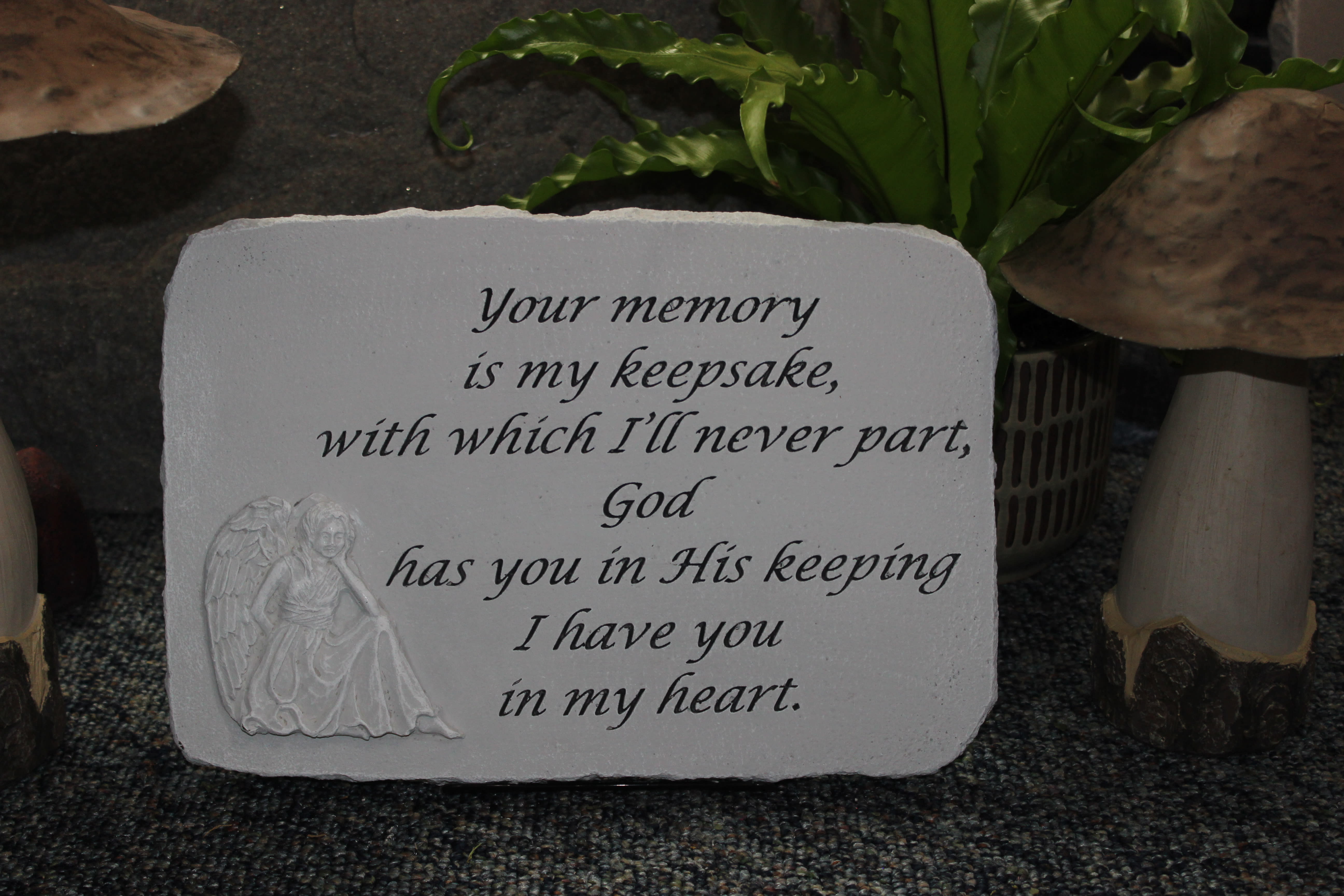 Memorial plaque with an angel and a sympathy verse