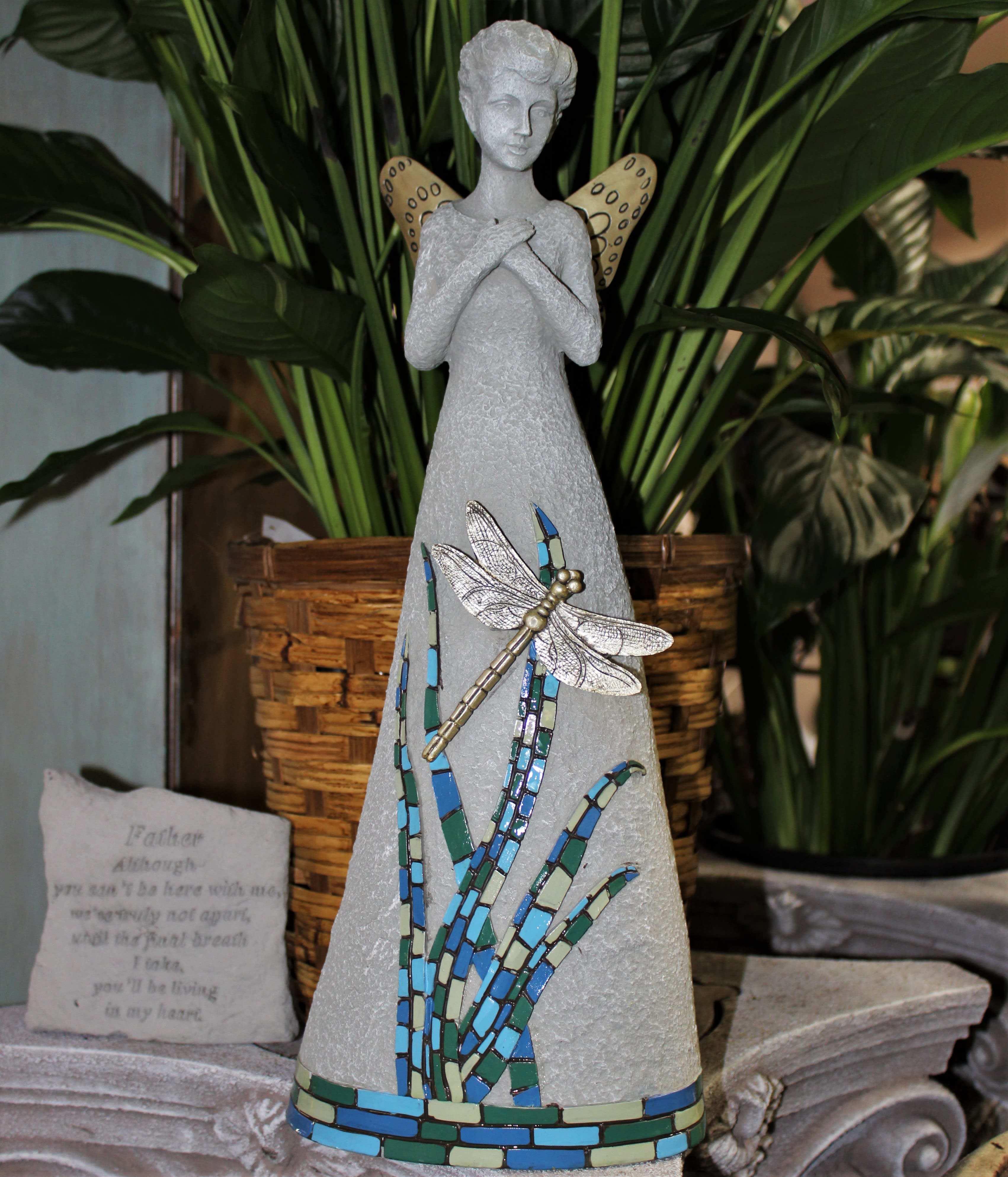 Decorative angel figurine with a dragonfly and mosaic accents