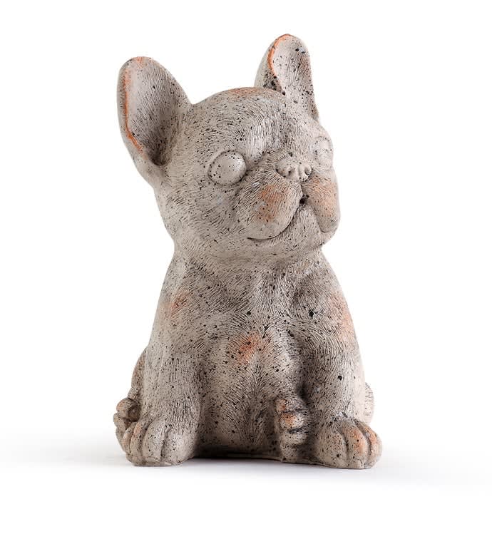 Small gray dog figurine sitting on a white background