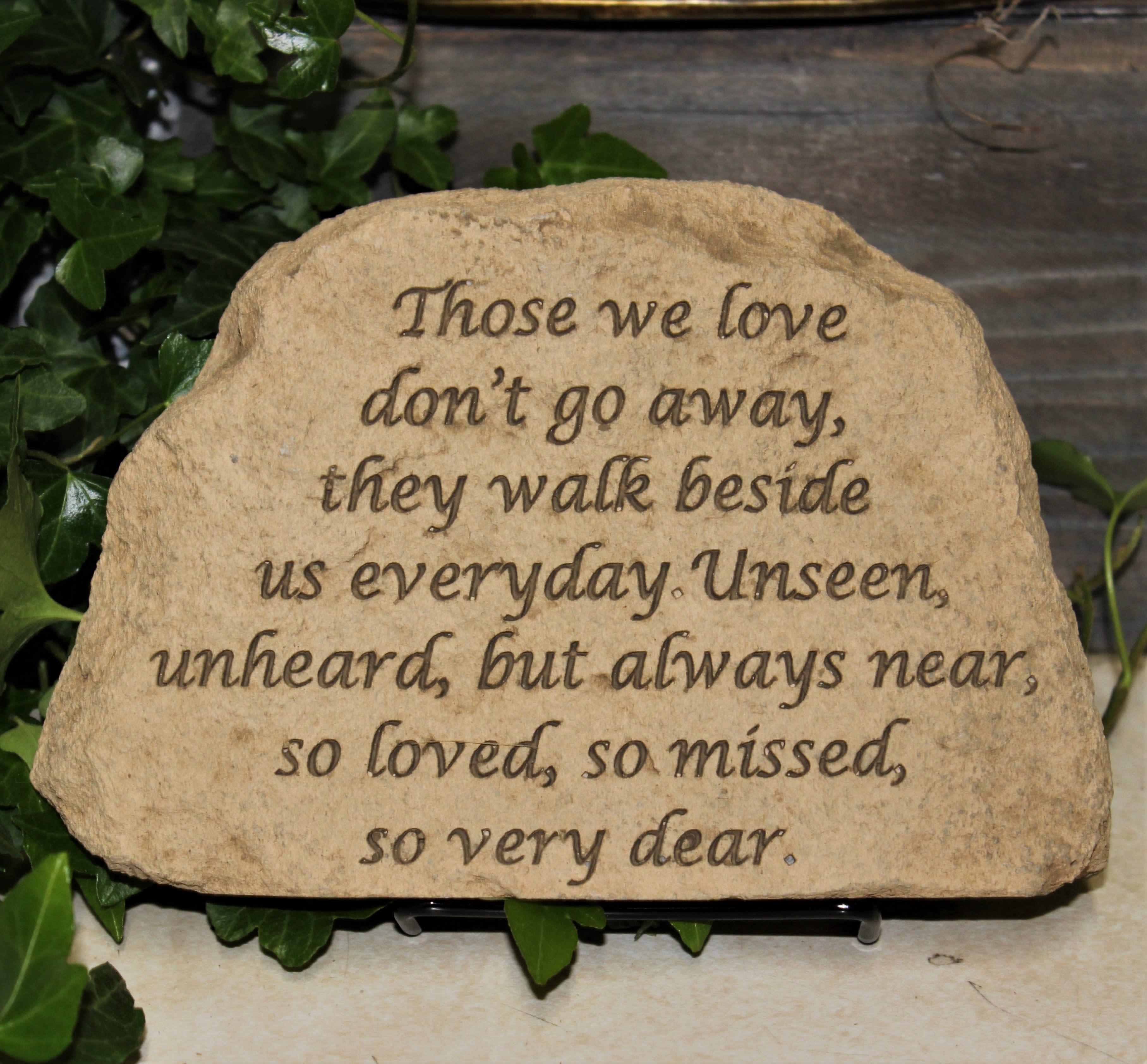 Engraved memorial stone with a sympathy quote