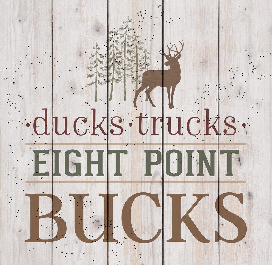 Wooden sign with a deer graphic and the words Ducks Trucks Eight Point Bucks