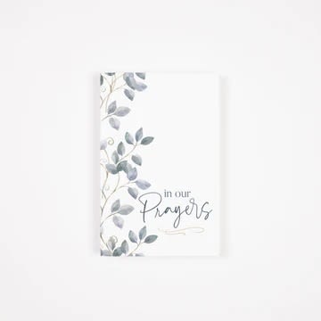 Sympathy card with leafy border and the words in our Prayers