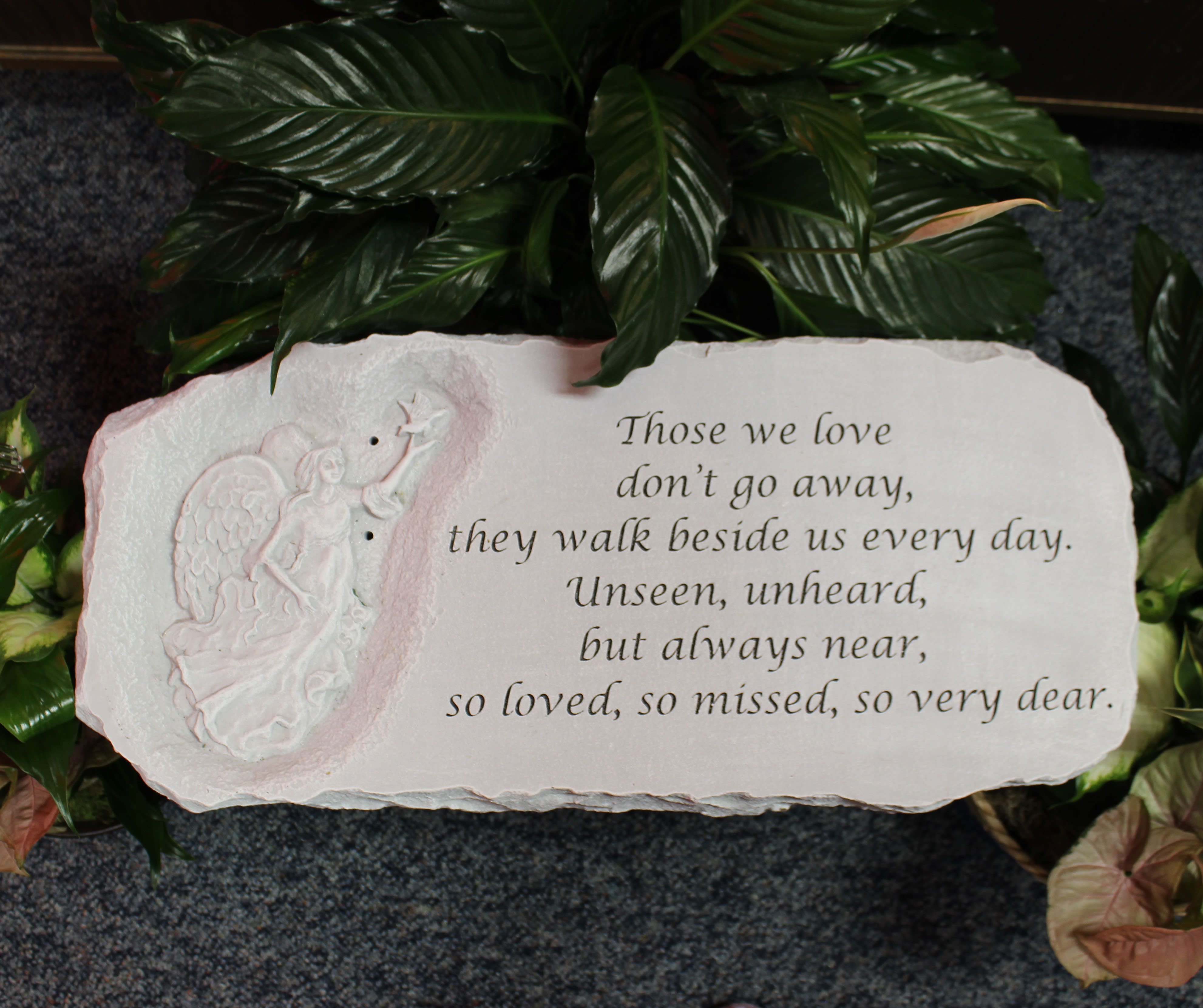 Memorial plaque with an angel relief and engraved sympathy verse