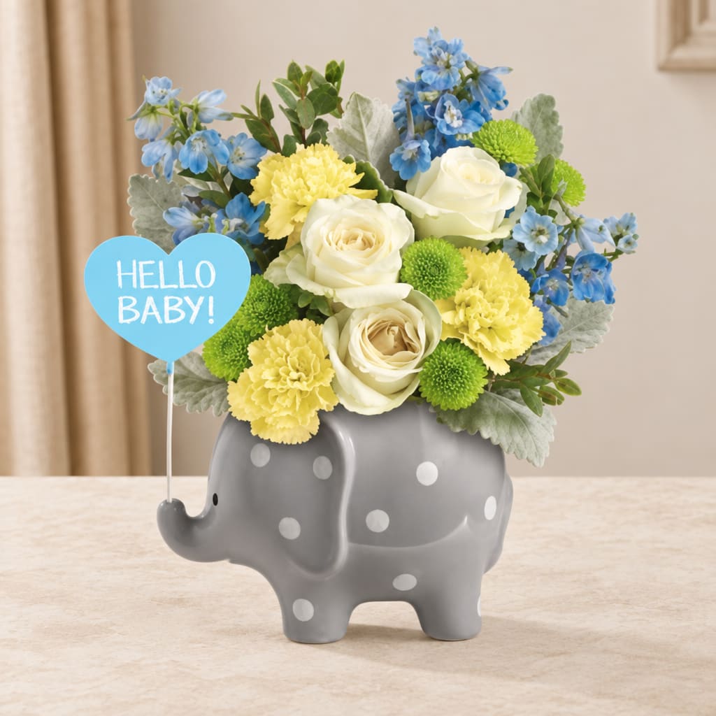Blue and yellow flower arrangement in a gray elephant vase with a "Hello Baby!" sign