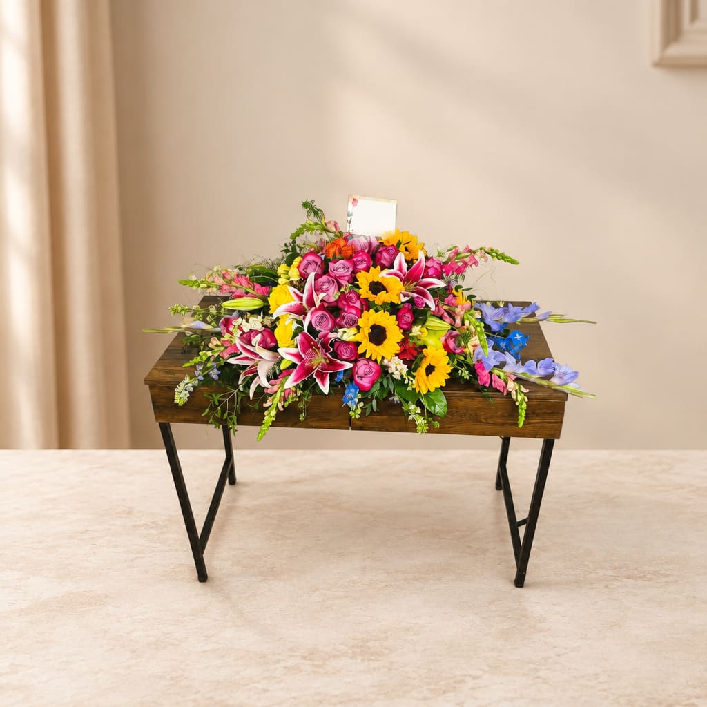 Bright mixed flower arrangement on a wooden table